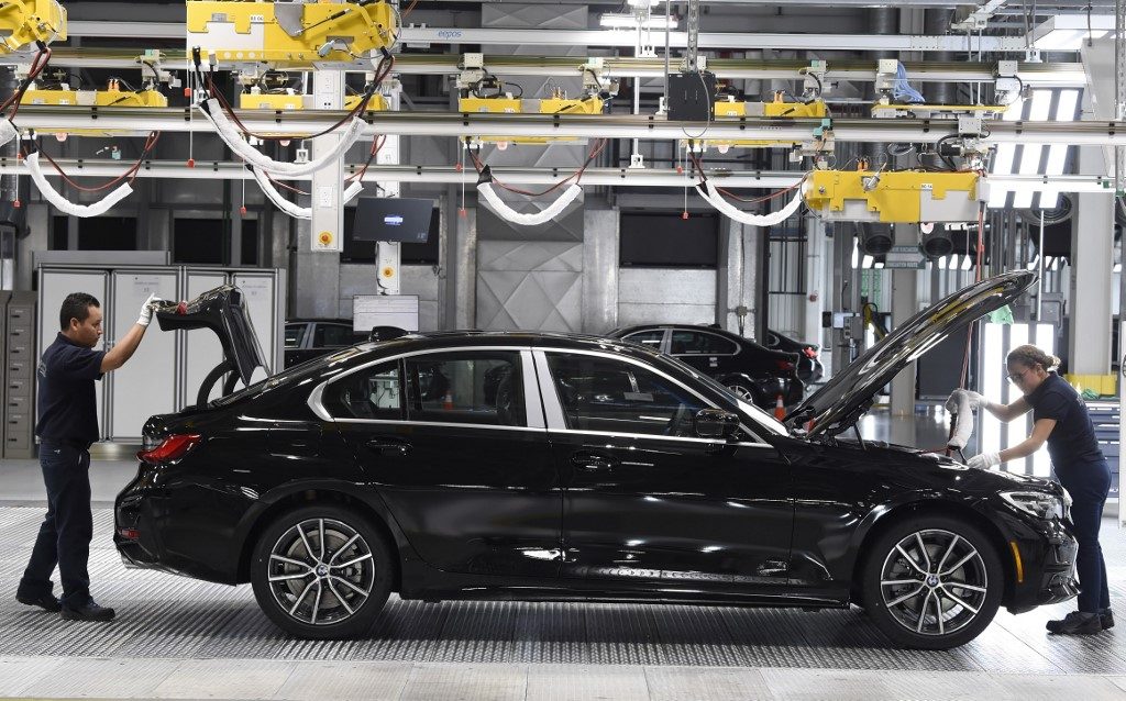 BMW cuts jobs, ends self-driving project with Mercedes