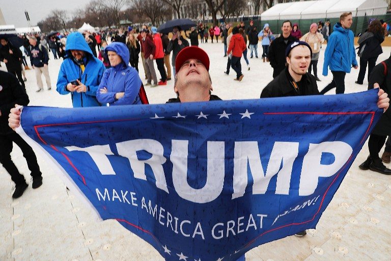 YES TO TRUMP. US President Donald Trump supporters react on the National Mall to the inauguration of US President Donald Trump on January 20, 2017 in Washington, DC.  Spencer Platt/Getty Images/AFP 