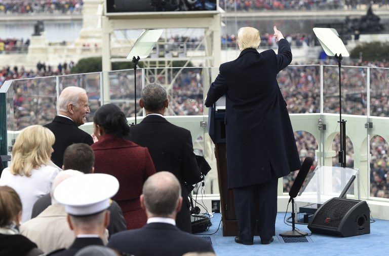 INAUGURAL ADDRESS. US President Donald Trump acknowledges the crowd during the Presidential Inauguration at the US Capitol in Washington, DC, on January 20, 2017. Saul Loeb/Pool/AFP 