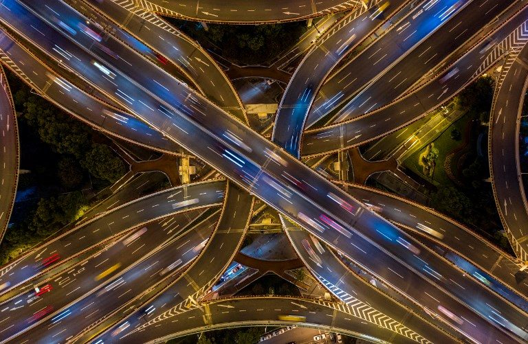 BUSY INTERSECTION. An aerial picture taken on the night of November 12, 2018 shows traffic on an elevated intersection in downtown Shanghai, China. Photo by Johannes Eisele/AFP  