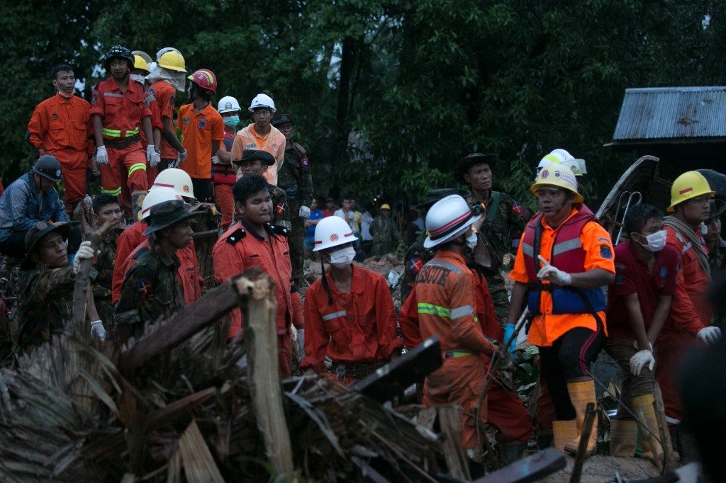 Myanmar battles rising floodwaters after landslide kills 52