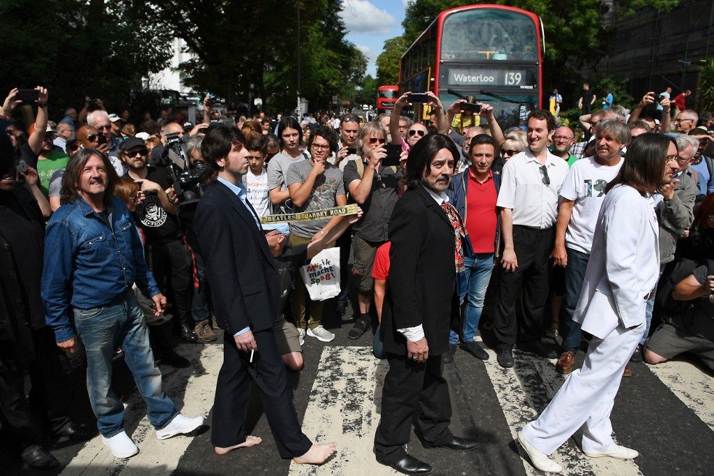 Beatles fans come together for 50th anniversary of Abbey Road photo