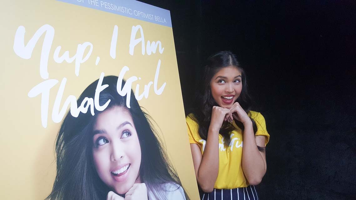 Maine makes a funny face while posing for the cameras during her book launch. 