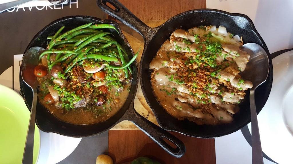 LOCAVORE FAVORITES. The sizzling sinigang and the lechon oyster sisig are still the restaurant's bestselling dishes. 