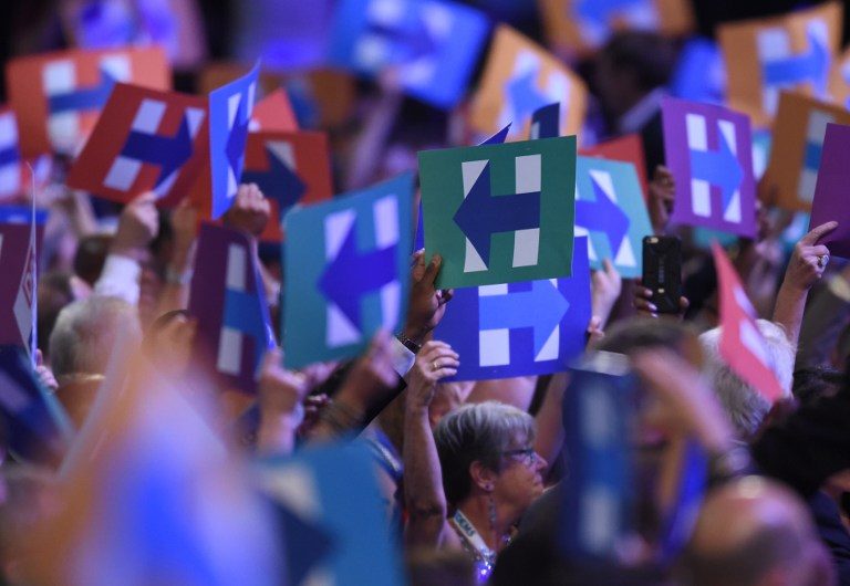 SEA OF Hs. Delegates hold up signs of support for Hillary Clinton during Day 2 of the Democratic National Convention at the Wells Fargo Center in Philadelphia, Pennsylvania, July 26, 2016. Timothy A. Clary/AFP 
