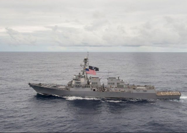 US warship sails by South China Sea reef, irking Beijing