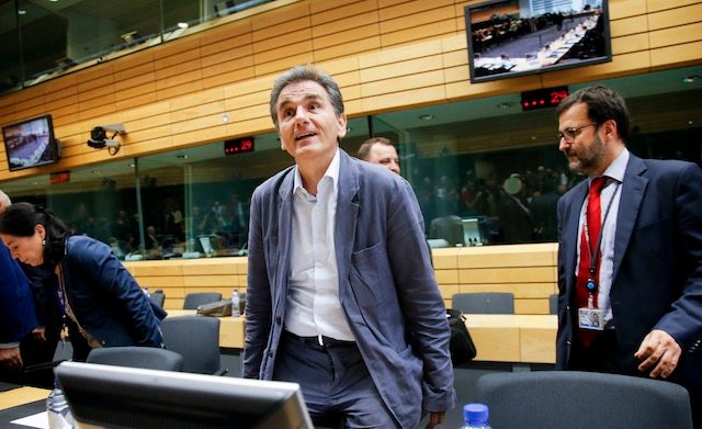 SEEKING A DEAL. Greek Finance Minister Euclid Tsakalotos (C) at the start of a special Eurogroup Finance ministers meeting on Greece, at European Council headquarters in Brussels, Belgium, July 11, 2015. Olivier Hoslet/EPA 