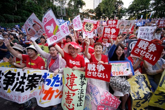 Japan lawmakers pass security bills despite public anger