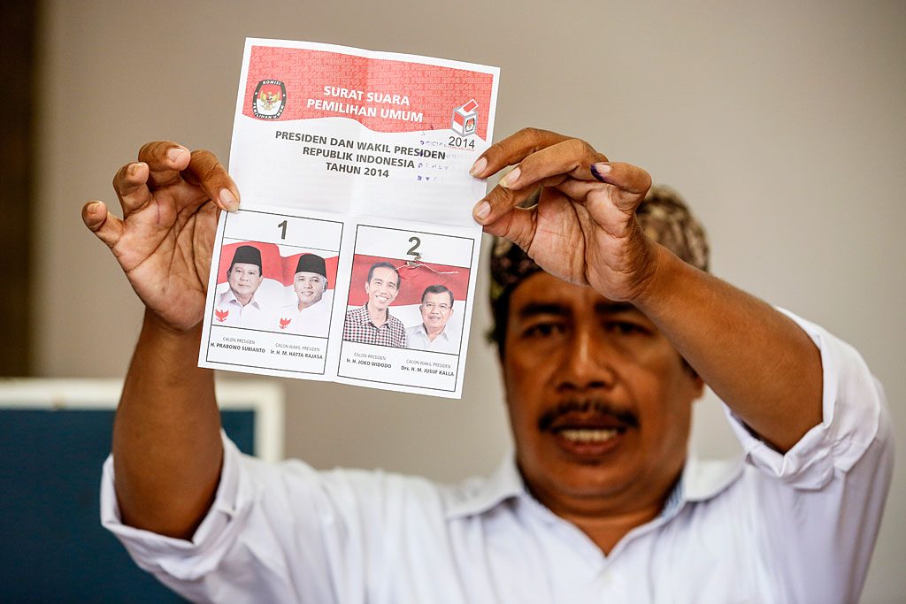 VOTE FOR NUMBER 2. An election officer holds up a ballot during the counting of votes in Denpasar. Photo by Made Nagi/EPA