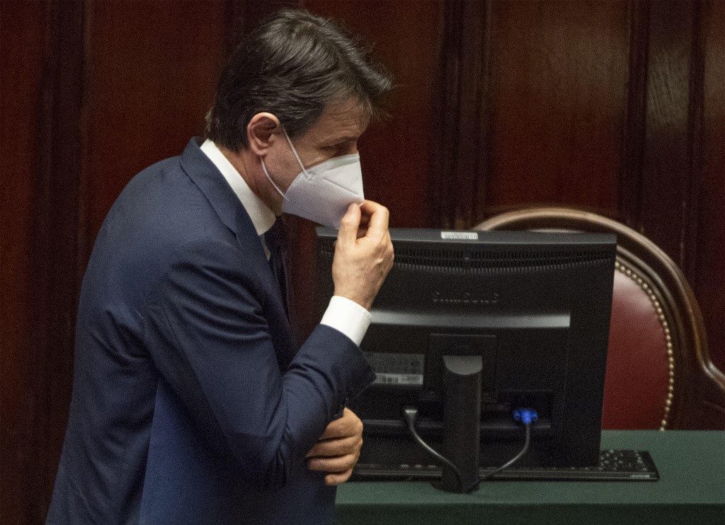 ITALY. This photo taken on April 21, 2020 and provided by Italian news agency ANSA shows Italy's Prime Minister Giuseppe Conte putting back on his face mask after addressing Parliament in Rome, during the country's lockdown aimed at curbing the spread of the COVID-19 infection, caused by the novel coronavirus. File photo by ANSA/AFP 