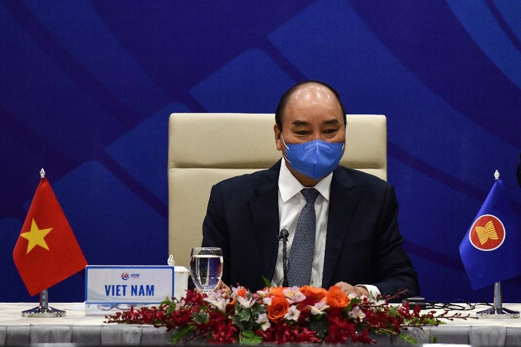 VIETNAM. Vietnam's Prime Minister Nguyen Xuan Phuc wearing a face mask waits for the start of a live video conference on the special Association of Southeast Asian Nations (ASEAN) Summit on the COVID-19 pandemic in Hanoi on April 14, 2020. File photo by Manan Vatsyayana/Pool/AFP 