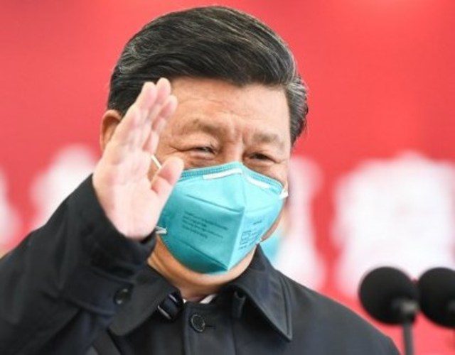 CHINA. This photo released on March 10, 2020 by China's Xinhua News Agency shows Chinese President Xi Jinping wearing a mask as he waves to a coronavirus patient and medical staff via a video link at the Huoshenshan hospital in Wuhan, in China's central Hubei province on March 10, 2020. File photo by Xie Huanchi/Xinhua/AFP 