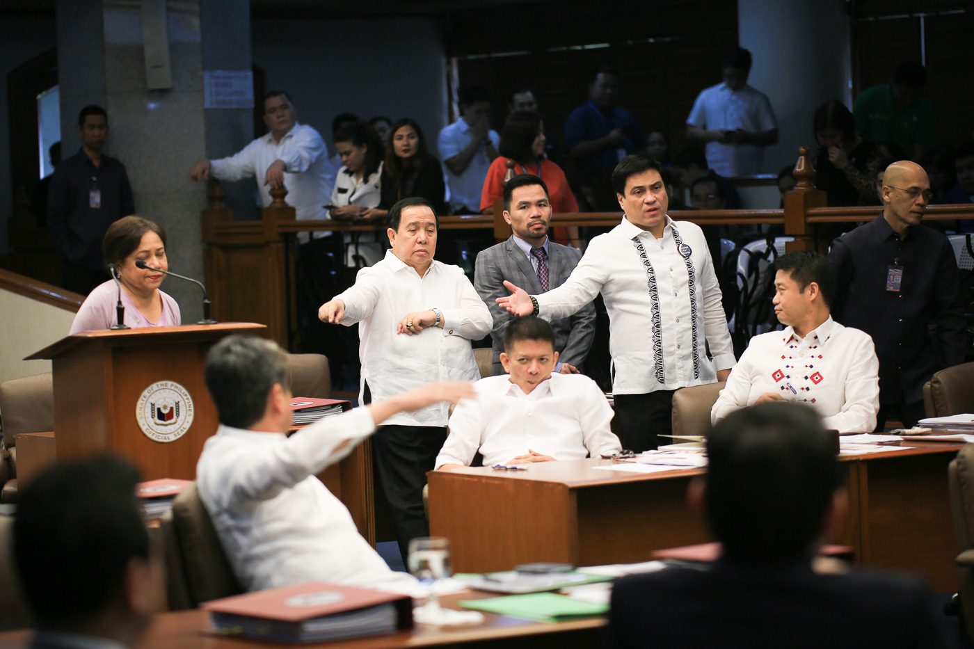 POLITICAL GESTURES. Philippine senators nearly came to blows over the supposed exclusion of 7 administration senators from the resolution against the killings of minors during a session on September 27, 2017. Photo by Joseph Vidal  