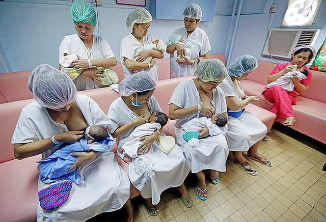 SAVINGS. Filipino mothers breastfeed their newly born babies during the 'First Embrace' campaign for Early Essential Newborn Care of the World Health Organization (WHO) inside Fabella government maternity hospital in Manila, Philippines. File photo by Ritchie B. Tongo/EPA
  