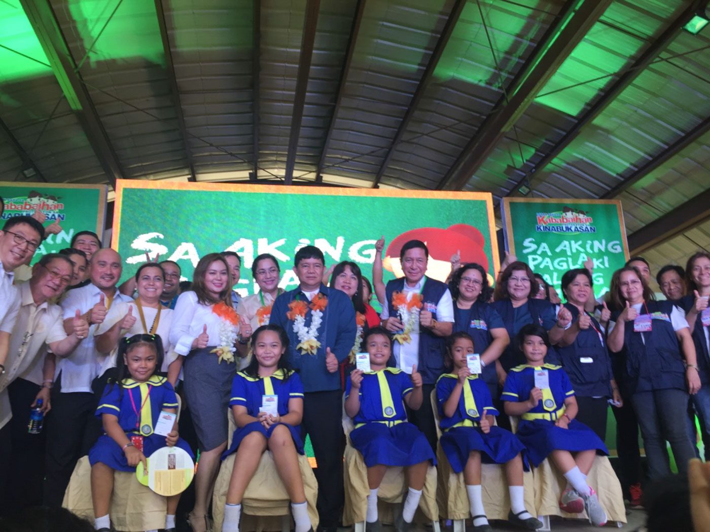 VACCINATED. Mandaluyong Representative Alexandria Gonzales (5th from left), Mayor Carmelita Abalos (6th from left), and Health Undersecretary Gerardo Bayugo (8th from left) pose with schoolgirls after their vaccination. Photo by Mara Cepeda/Rappler  