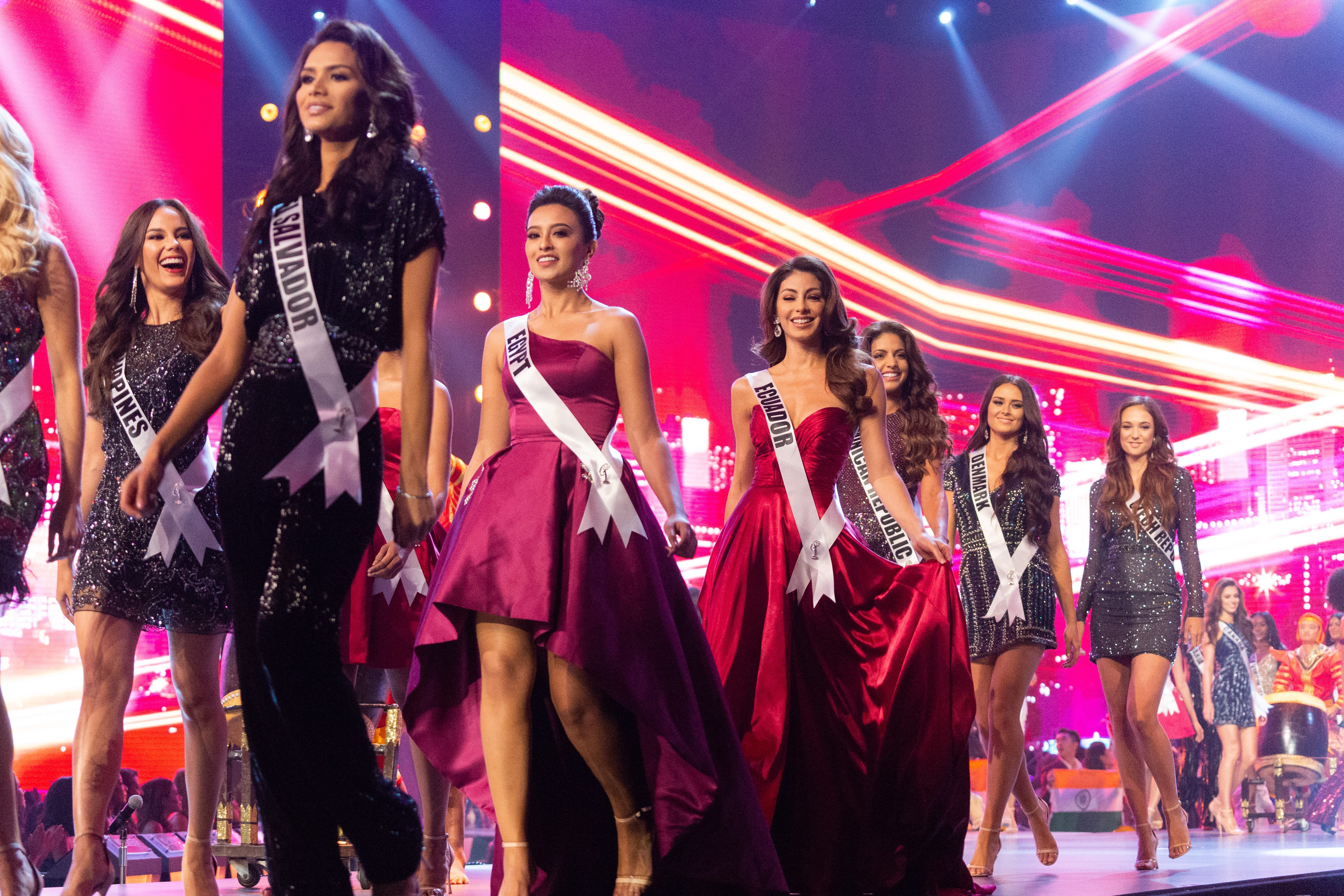 OPENING. Catriona Gray, Miss Philippines 2018; Marisela De Montecristo, Miss El Salvador 2018; Nariman Khaled, Miss Egypt 2018; Virginia Limongi, Miss Ecuador 2018; Aldy Bernard, Miss Dominican Republic 2018; Helena Heuser, Miss Denmark 2018; and Lea Steflickova, Miss Czech Republic 2018; on stage in fashion by Sherri Hill during the opening of Miss Universe. Photo by the Miss Universe Organization 