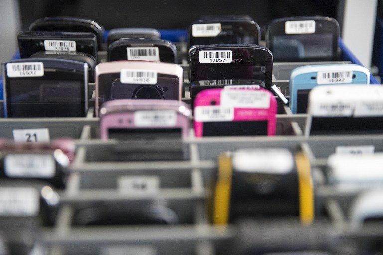 PHONE ARCHIVES. Phones from hundreds of models are stored at the research lab of the Israeli firm Cellebrite's technology to enable researchers to find vulnerabilities to crack into them, on November 9, 2016 in the Israeli city of Petah Tikva. Photo by Jack Guez/AFP 
