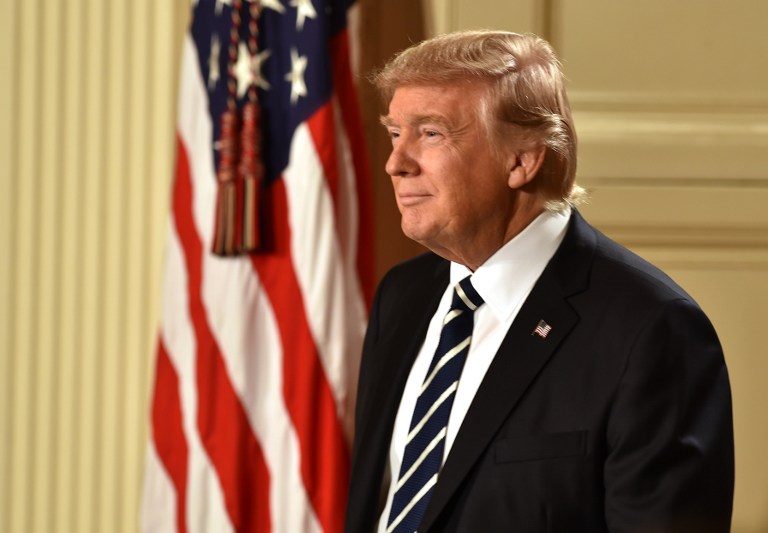 Trump menyambut 100 hari pertama masa jabatannya, dan mengatakan ‘pertempuran’ masih di depan