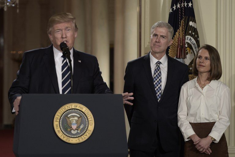 SCOTUS PICK. Judge Neil Gorsuch (C) and his wife Marie Louise look on, after US President Donald Trump nominated him for the Supreme Court, at the White House in Washington, DC, on January 31, 2017. Brendan Smialowski/AFP 