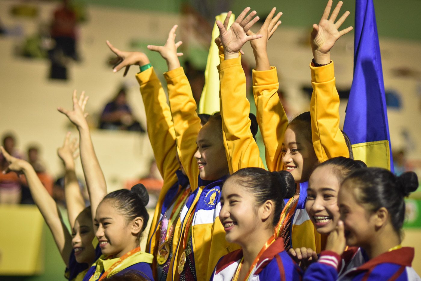 WINNERS. Student-athletes feel happy and proud as they received their medals during the awarding ceremonies for the Gymnastics competition at the EBJ Gymnasium. Photo by LeAnne Jazul/Rappler 