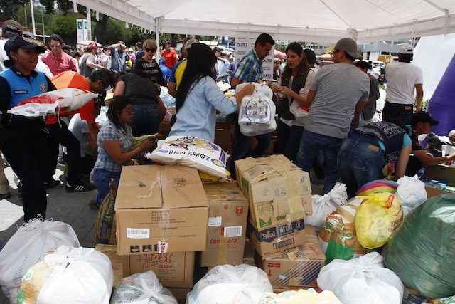 AID. Citizens of Quito receive humanitarian aid after a 7.8 magnitude earthquake in Quito, Ecuador, April 17, 2016. Fredy Constante/EPA 