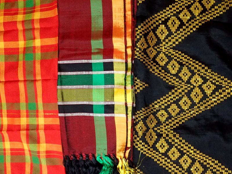 DIFFERENT FABRICS AND USES. A tubao (headscarf), shawl (middle), and a malong – all inaul. 