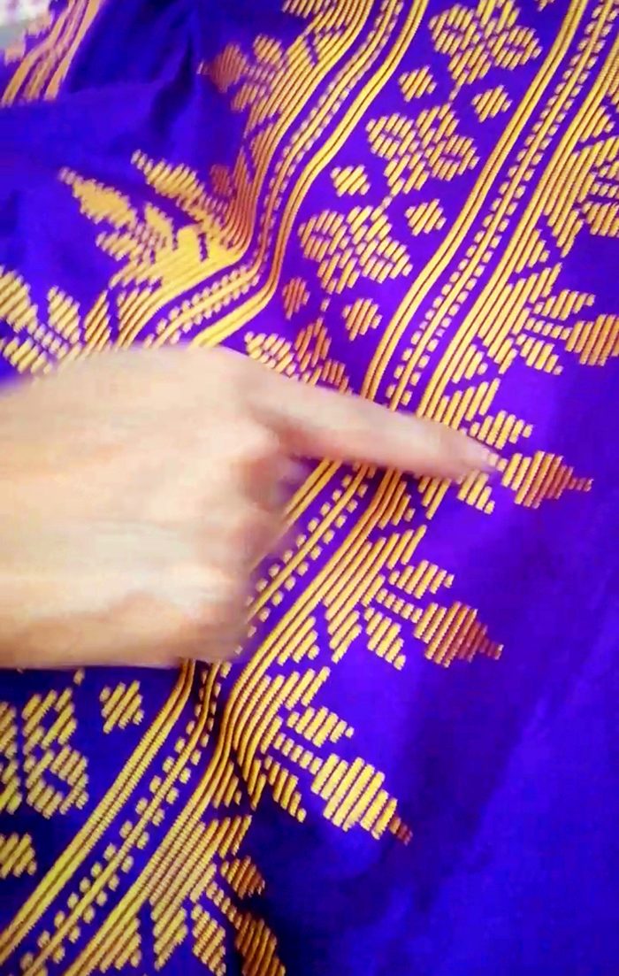 WINNING MALONG. Noraina and Baikan Ansing’s winning entry at the inaul malong competition. The pattern is the traditional karanda. Noraina’s finger points to the karanda in the cloth. 