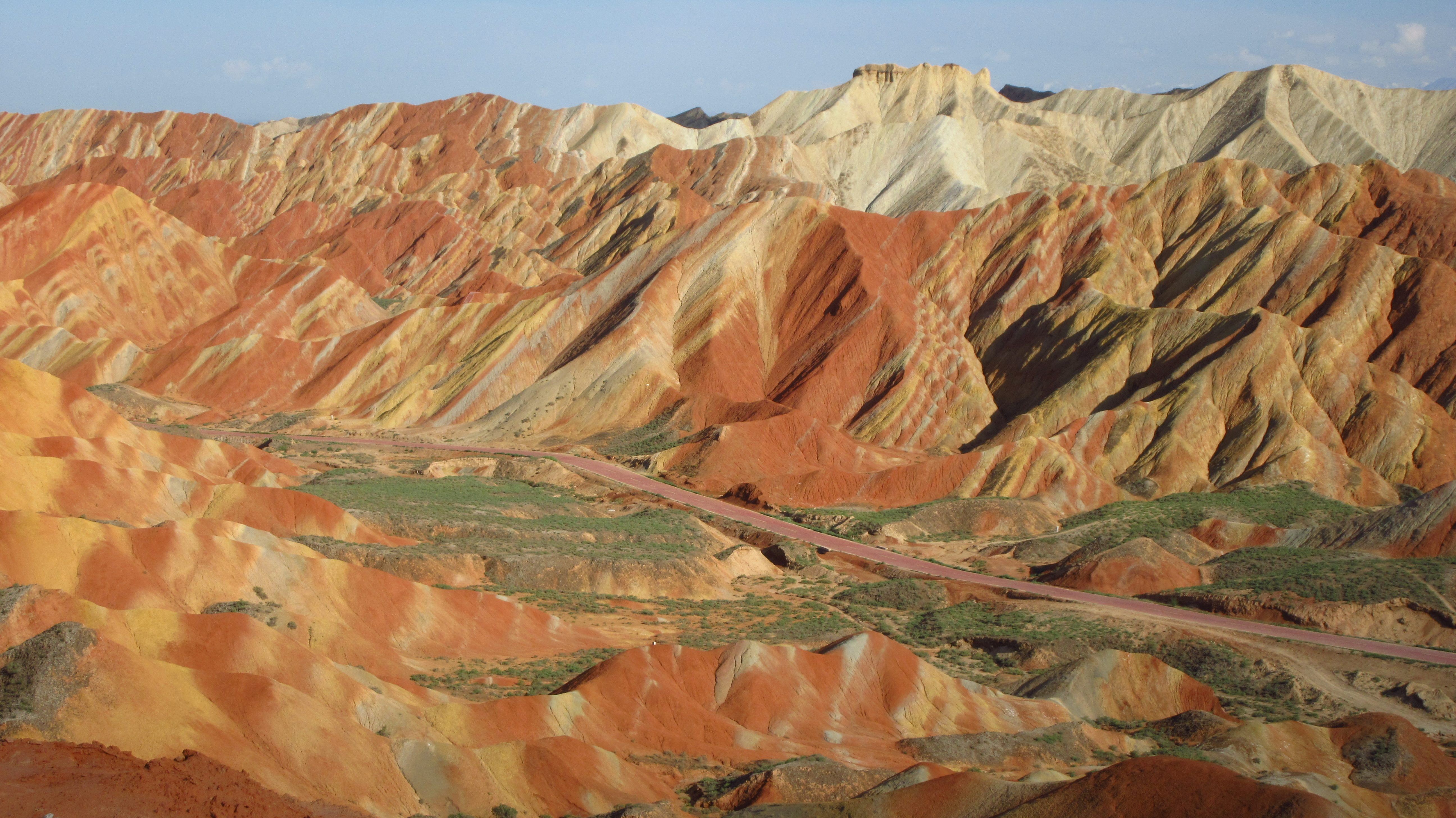 EXPLOSION OF COLORS. You'll see a mix of yellows, reds and whites in varying shades during your trip to the Rainbow Mountains. 