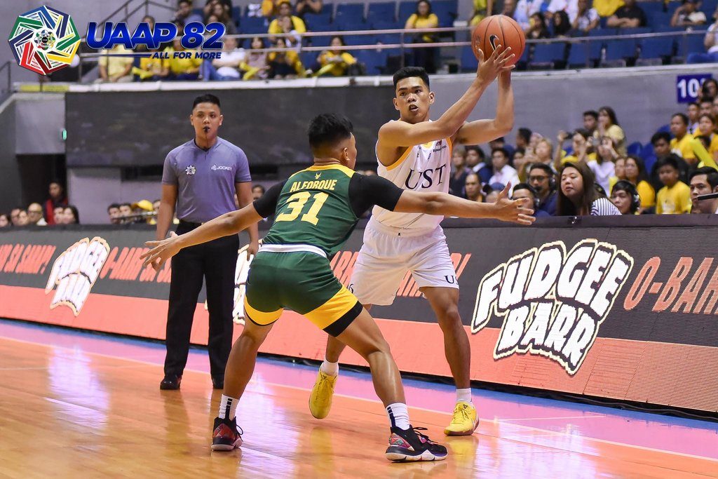 UST holds off FEU rally to move up UAAP stepladder semis