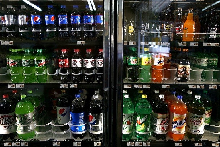 WHO urges price hikes on sugary drinks in obesity fight