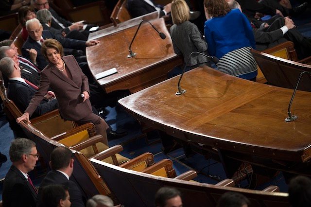 EMPTY SEATS. House Democratic Leader Nancy Pelosi (L) looks at empty chairs prior to Israeli Prime Minister Netanyahu (not pictured) delivering a speech to a joint meeting of Congress on the floor of the US House of Representatives, in the US Capitol in Washington, DC, USA, 03 March 2015. Shawn Thew/EPA 