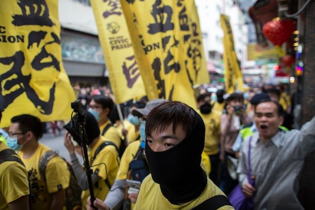 Hong Kong police arrest 33 after anti-mainland march