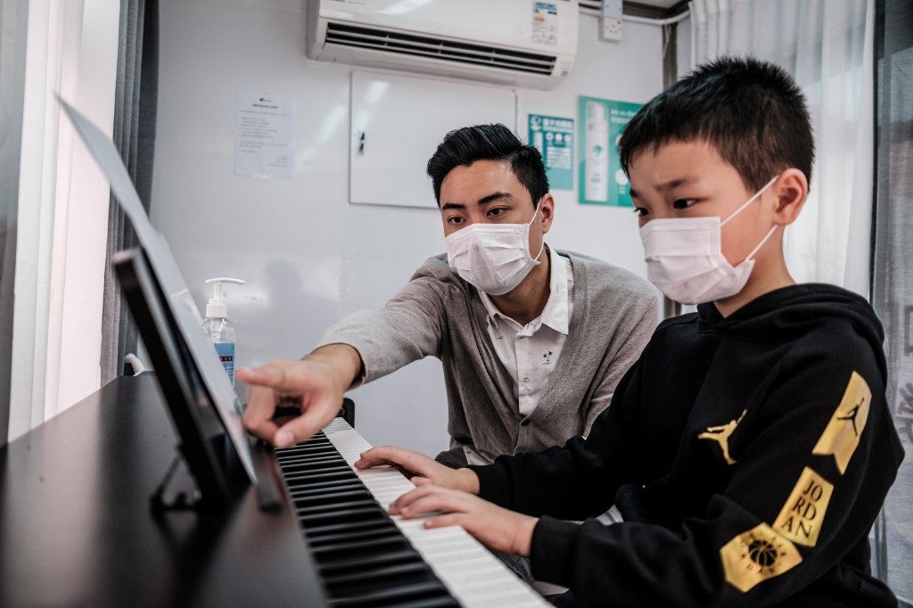 Piano van: Hong Kong music lessons go mobile to beat virus