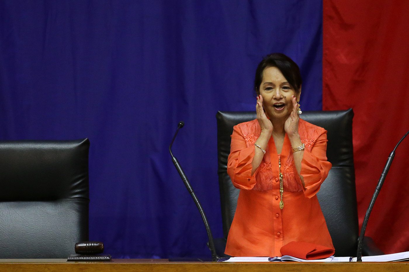 QUEEN OF THEM ALL. Speaker Gloria Macapagal Arroyo cups her hands to address the lawmakers who installed her as the new House Speaker. The microphones were turned off during the coup. Photo by Ben Nabong/Rappler   