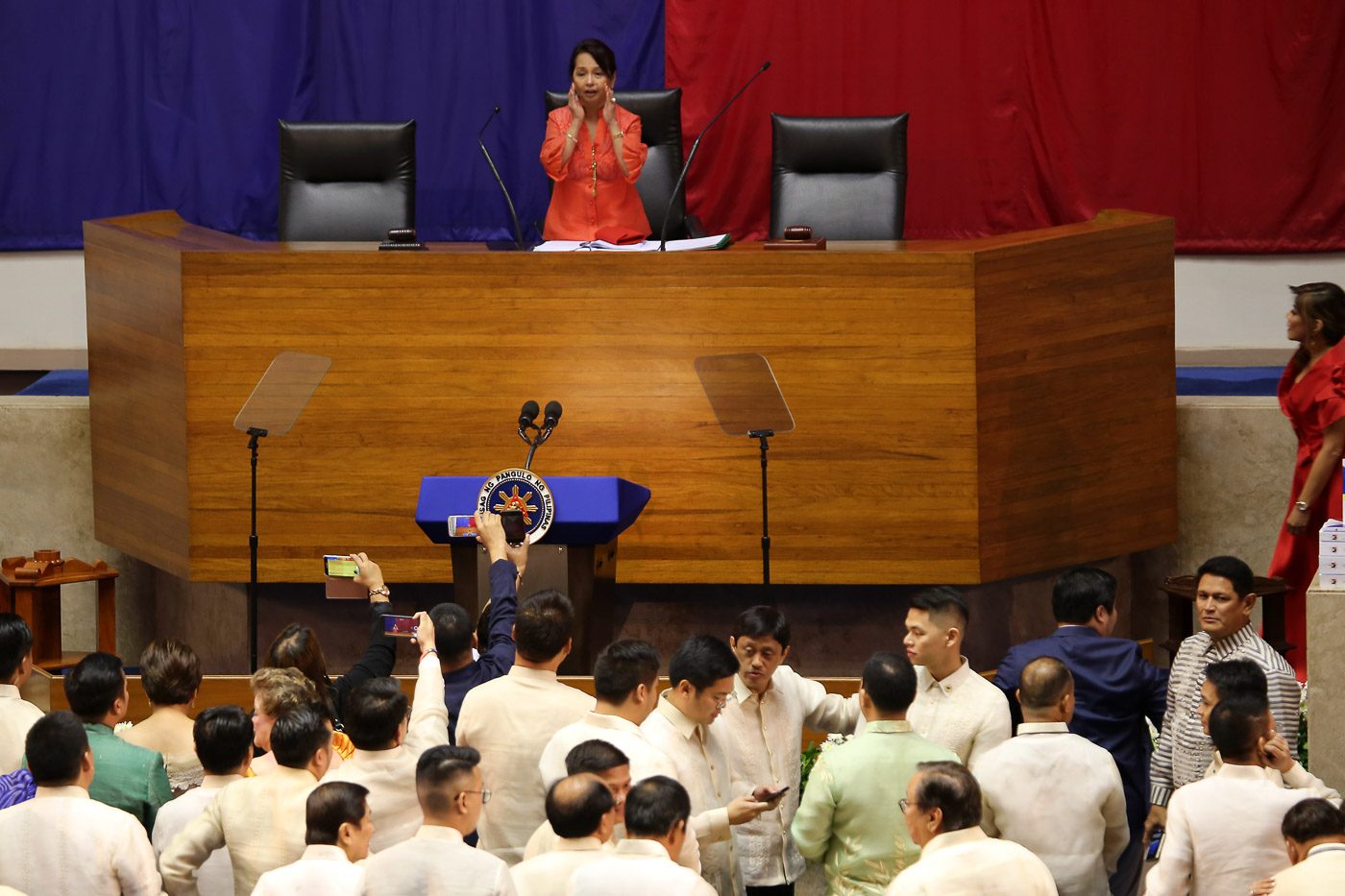 NEW SPEAKER. Former president and now Pampanga 2nd District Representative Gloria Macapagal Arroyo stands at the rostrum after taking her oath as House Speaker on July 23, 2018. Photo by Ben Nabong/Rappler  