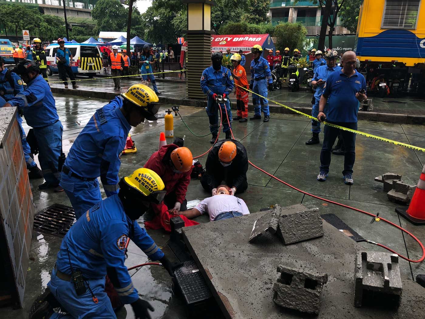 COLLAPSE. A civilian trapped under a collapsed structure is being rescued during the earthquake drill. Photo by Samantha Bagayas/Rappler 