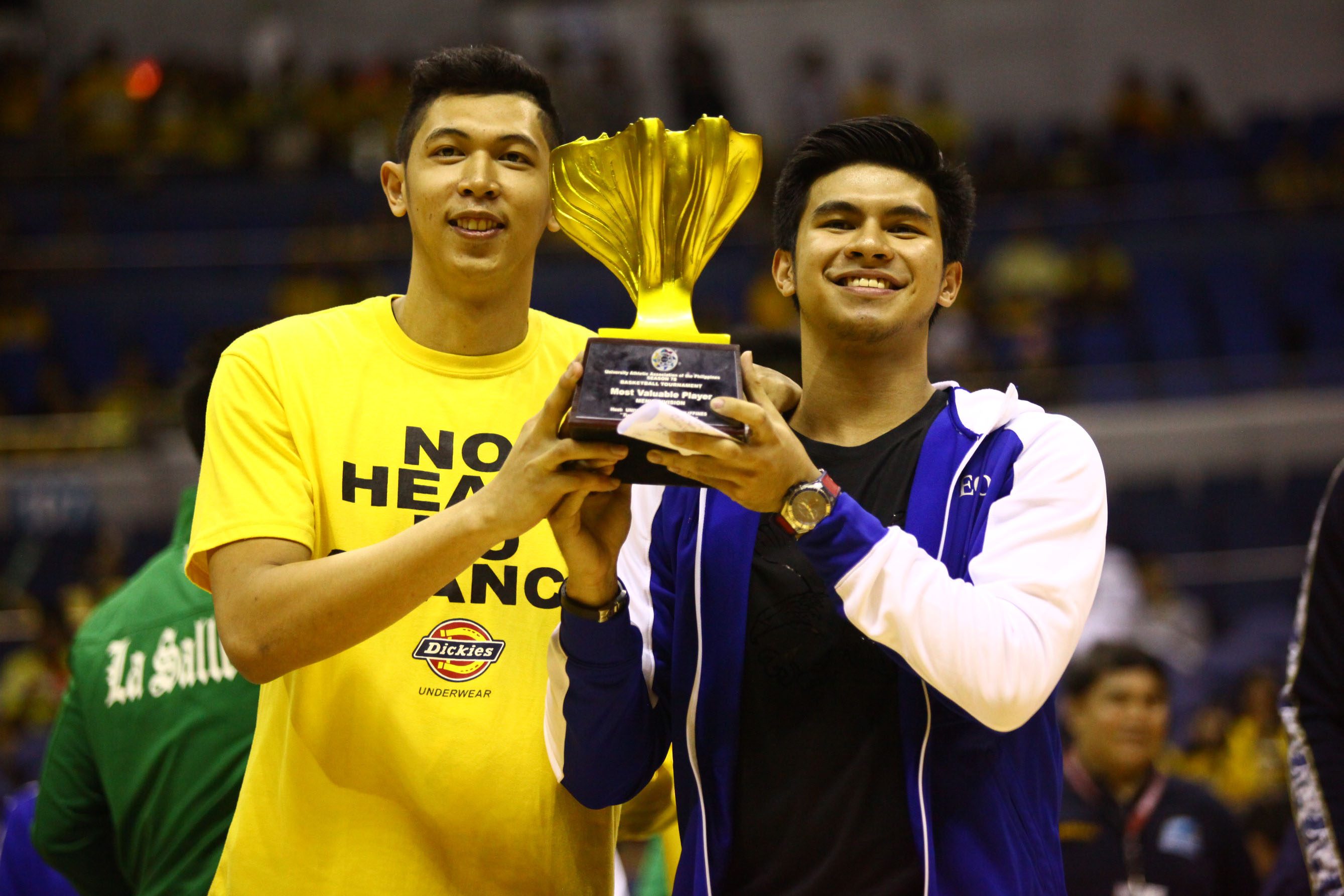 SHARING IS CARING. The top two leaders in the UAAP MVP race lift up the trophy. Photo by Josh Albelda/Rappler 
