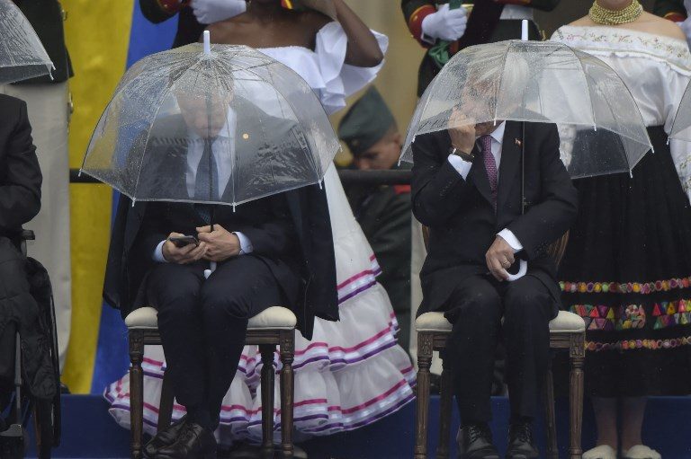 INAUGURAL. Argentina's President Mauricio Macri (left) and Chile's President Sebastian Pinera attend the inauguration of Colombia's new President Ivan Duque at Bolivar Square in Bogota on August 7, 2018. Photo by Raul Arboleda/AFP  