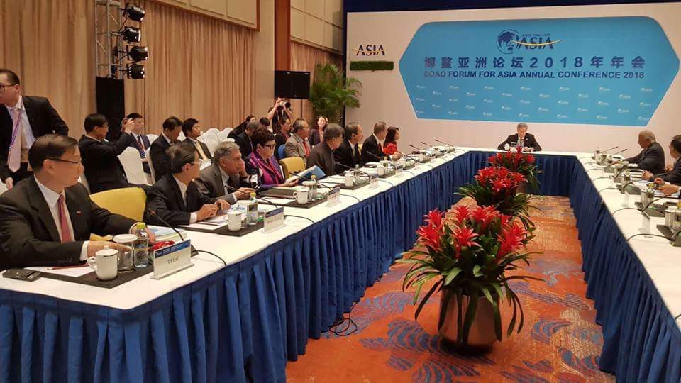 THE MEETING. Arroyo, seated at the far right corner, wears red during the BFA board's meeting. Photo from Beijing Review 