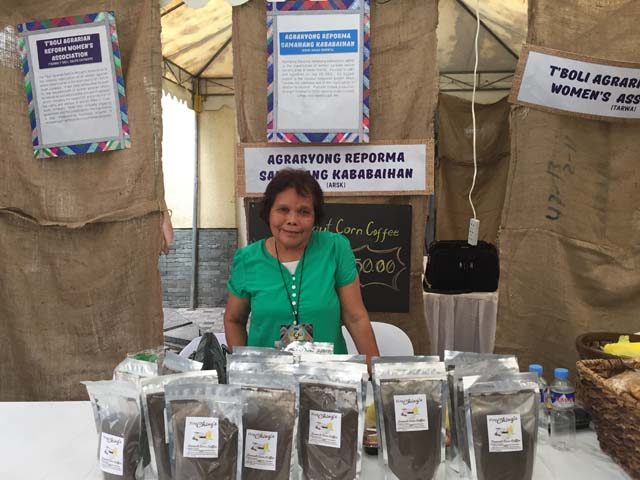 HAND MADE. Nay Conching from Davao Oriental proudly displays her very own Coconut Corn Coffee at the Women's Market - a marketplace of homegrown and handcrafted merchandise. Photo by Denise Nacnac/Rappler 
