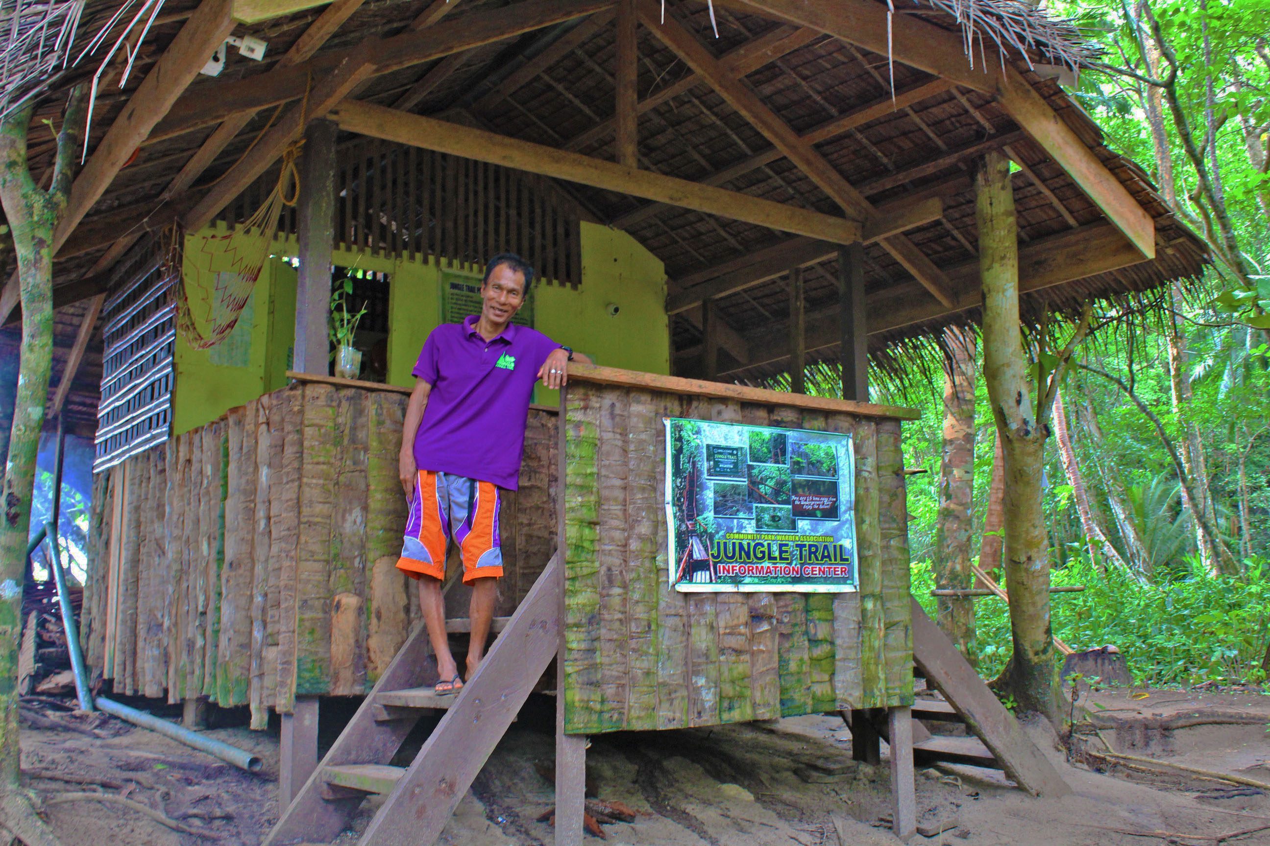 INFORMATION CENTER. A Tagbanua community park warden greets visitors with a smile as they pass by the Jungle Trailâs information center at trailhead. Photo by Keith Anthony Fabro 
