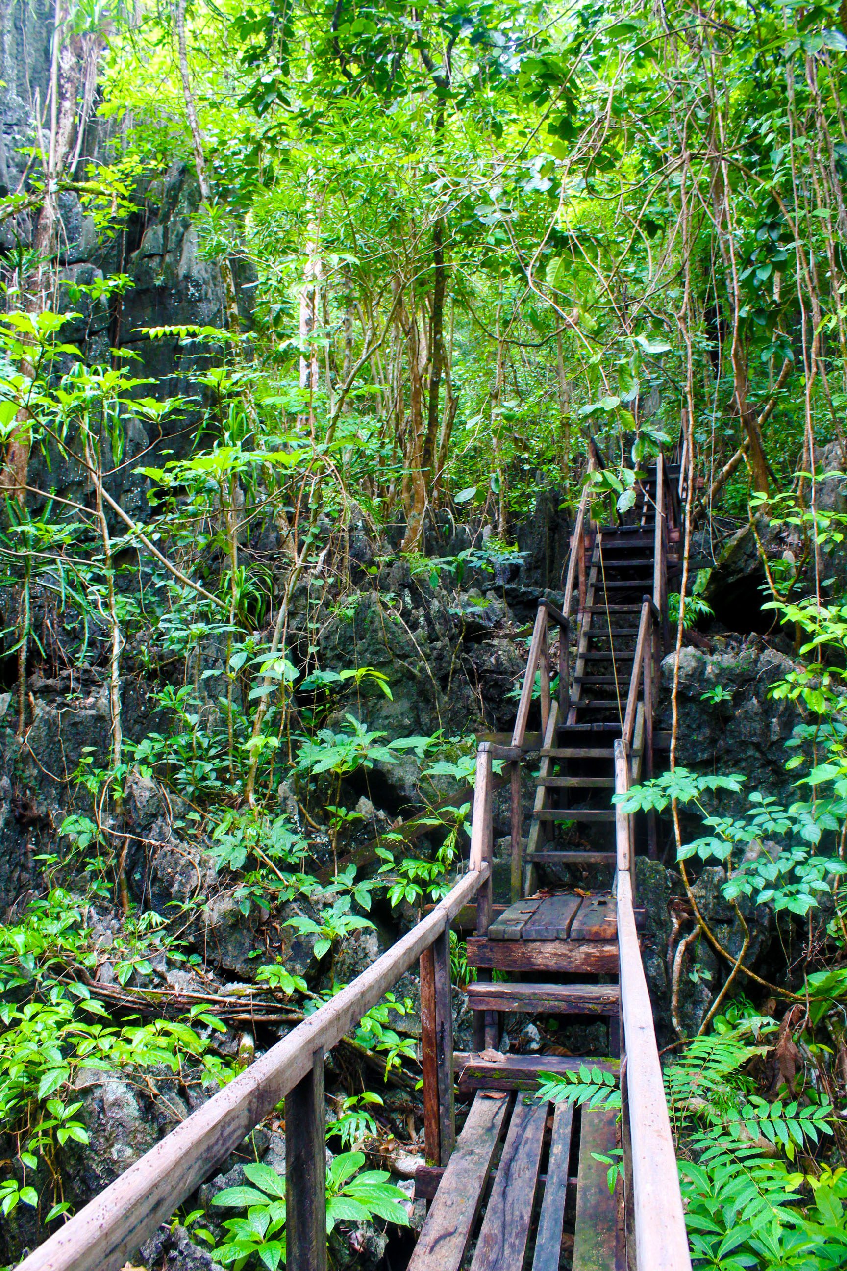 WATCH YOUR STEPS. Crossing through this wooden boardwalk laid atop and in between the magnificent karst mountain requires visitors extra care. Photo by Keith Anthony Fabro 