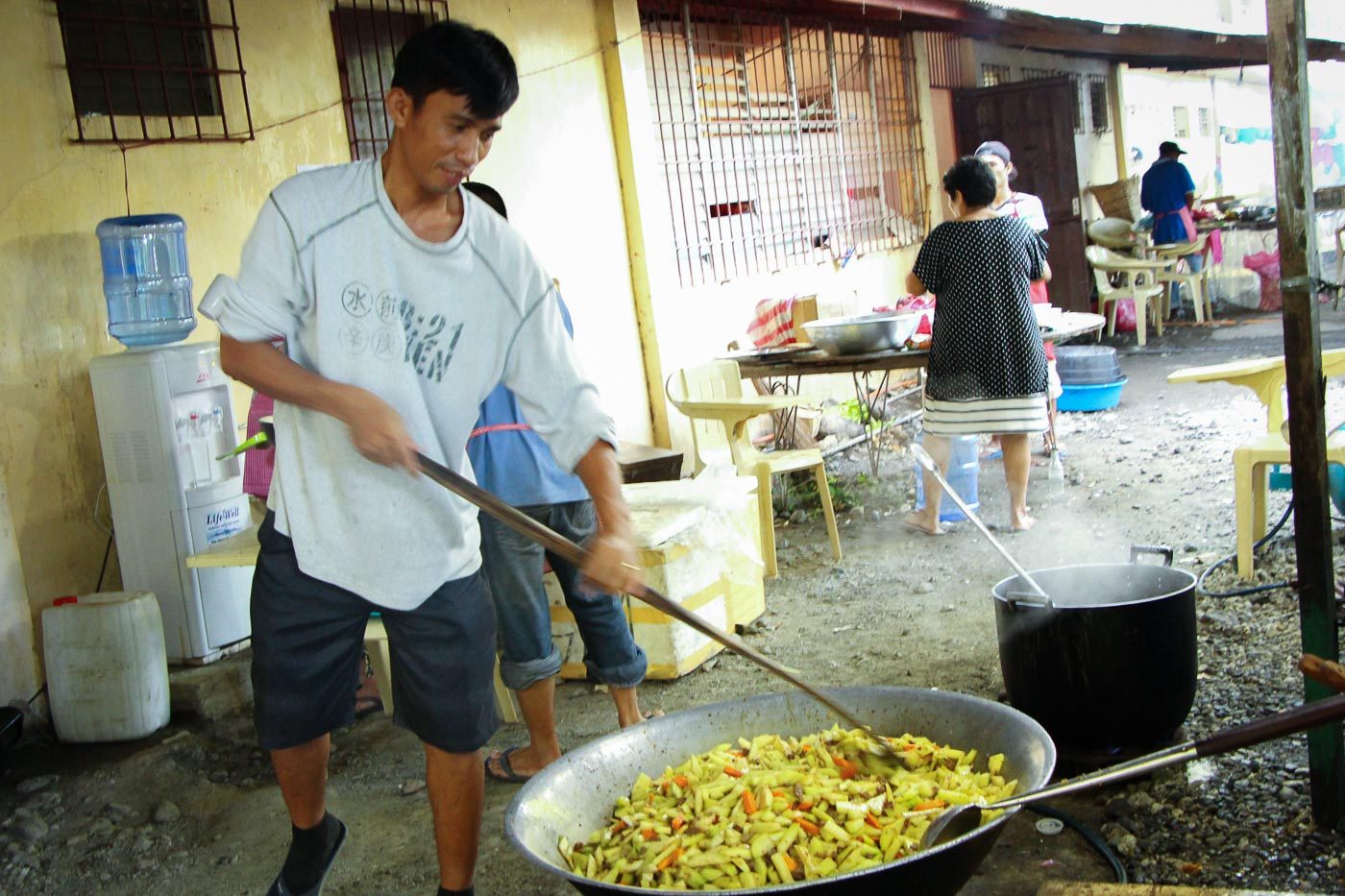 EFFORT CONTRIBUTIONS. Michael Jingoyon of Dipolog volunteer to cook the vegetables for the athletes.  