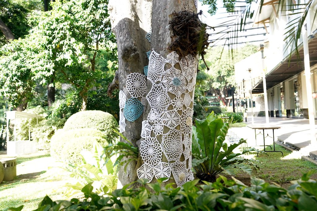 RETRO CHAPEL. Outside the Greenbelt chapel, the trees are covered in angelic blue and white crochet patterns. 