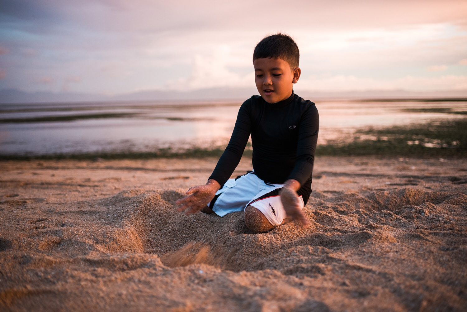 ENJOYING NATURE. 7 year-old Marco Bonifacio plays on the beach 
