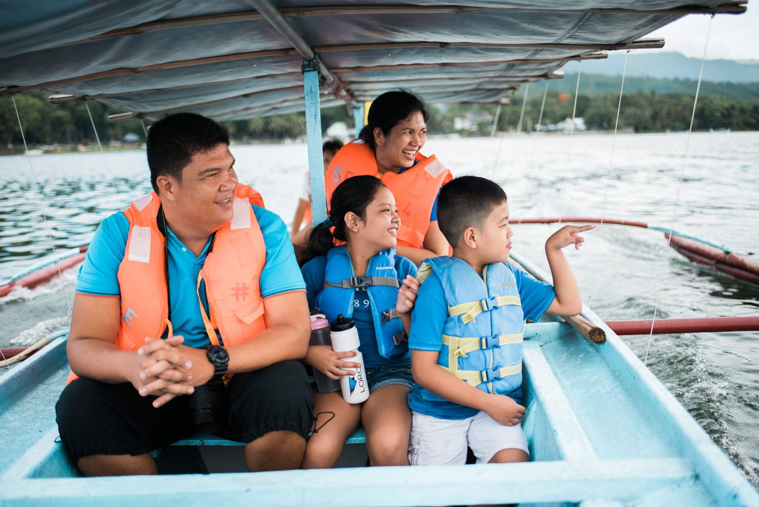 OUT AT SEA. The Bonifacio family rides a boat to Taal Volcano 