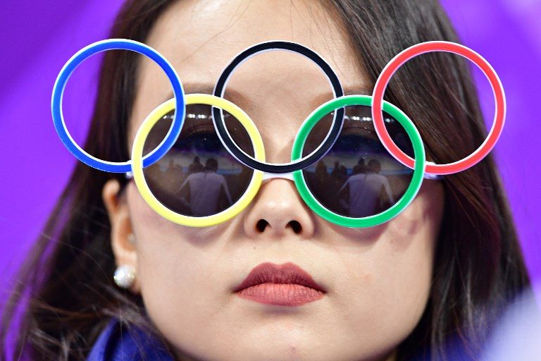 PYEONGCHANG 2018. A woman wears Olympic rings sunglasses during the figure skating team event men's single skating short program during the Pyeongchang 2018 Winter Olympic Games at the Gangneung Ice Arena in Gangneung on February 9, 2018. Photo by Mladen Antonov/AFP  