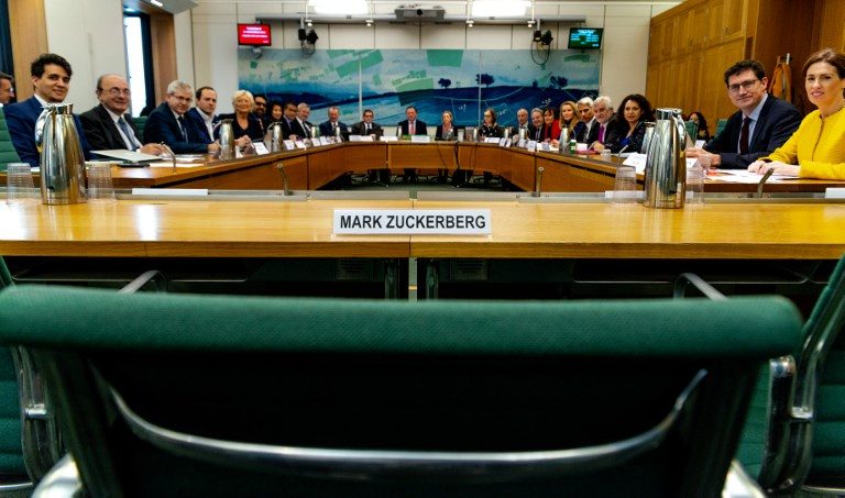 EMPTY SEAT. A handout photograph released by the UK Parliament on November 27, 2018 shows the International Grand Committee with representation from nine parliaments, a chair and the name plate for Facebook chief executive Mark Zuckerberg who was invited to give evidence, and declined the invitation, to the Digital, Culture, Media and Sport Committee investigation into disinformation and fake news at the Houses of Parliament in London on November 27, 2018. AFP Photo/Gabriel Sainhas/UK Parliament 