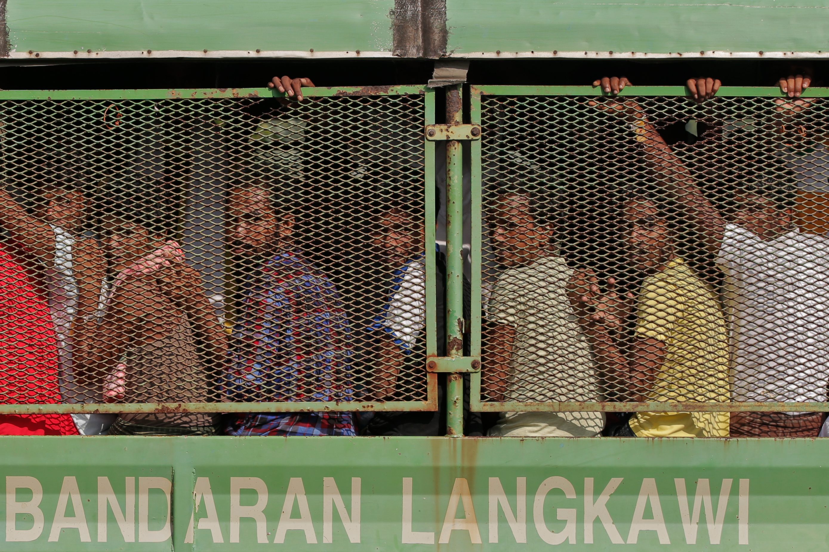 ASYLUM SEEKERS. Bangladeshi and Rohingya migrants are seen in a truck as they arrive at a naval base before being transferred to Kuala Kedah jetty with the navy ship 'KD Mahawangsa', in Langkawi, Malaysia. Photo by: EPA/Fazry Ismail 
