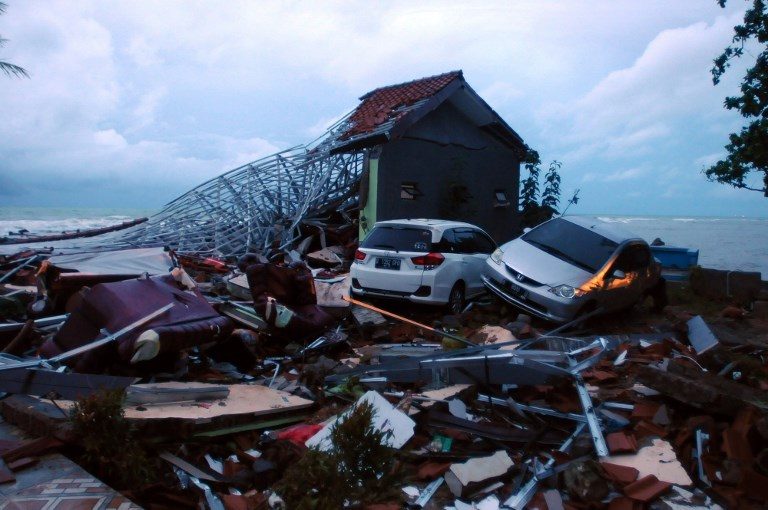 RUIN. Debris from damaged buildings and cars are seen near the beach in Anyer, Serang. Photo by Dasril Roszandi/AFP   
